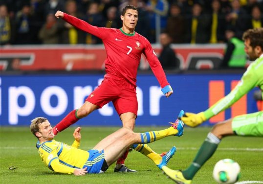 A hat-trick from Cristiano Ronaldo sealed Portugal's place at next summer's World Cup in a thrilling encounter with Sweden.