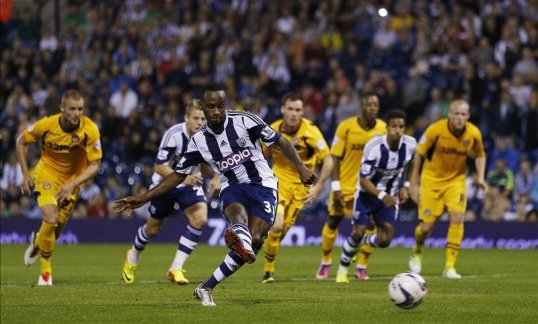 Saido Berahino grabbed a debut hat-trick to send West Brom through to the third round of the League Cup after beating Newport County.