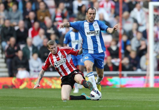 Wigan Athletic midfielder Jodi Gómez has had his claim for wrongful dismissal upheld by a Regulatory Commission.