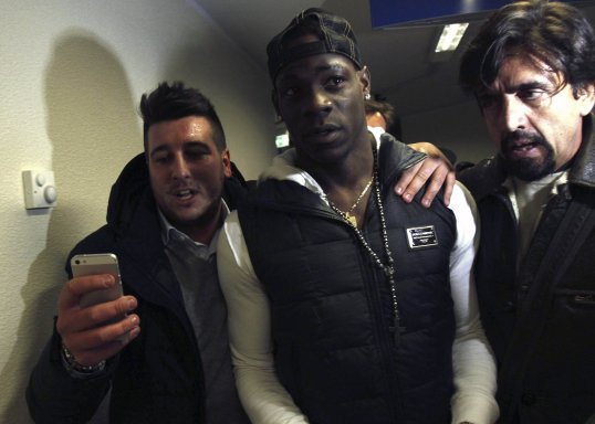 Police used tear gas after scuffles broke out as fans celebrated Mario Balotelli’s proposed move AC Milan.