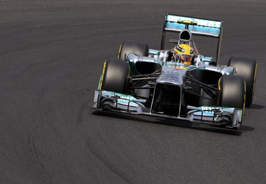 Lewis Hamilton lost the Hungarian Grand Prix lead when he was forced to pit in the 10th lap.