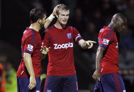 Chris Brunt has admitted Northern Ireland have a 'mountain to climb' if they are to reach the 2014 World Cup in Brazil.