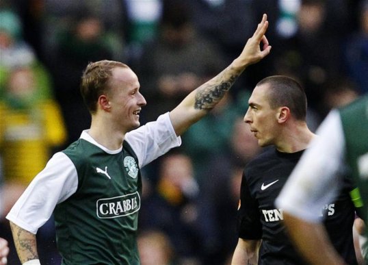 Hibernian striker Leigh Griffiths has been charged over an alleged racist comment on social networking site Twitter.