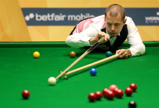 Barry Hawkins secured a semi-final place in the World Snooker Championship with a 13-7 victory over Ding Junhui at the Crucible.