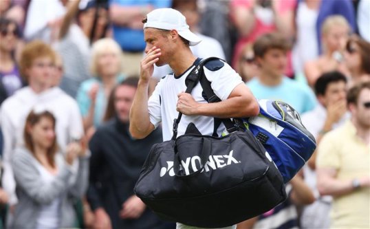 Leyton Hewitt has been beaten in straight sets by Uzbekistan’s Denis Istomin in the second round of the Brisbane International.