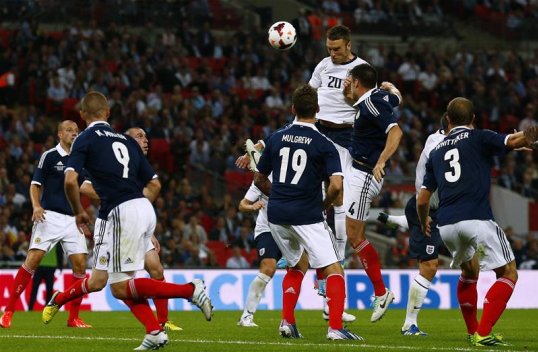 England manager Roy Hodgson was delighted to see striker Rickie Lambert score on his international debut to give the Three Lions a 3-2 victory over Scotland at Wembley.