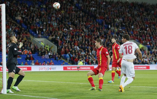 Serbia took a comfortable lead into half-time against a flat Wales side in their World Cup qualifier on Tuesday evening.