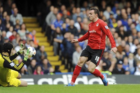An early Jordon Mutch goal has sent Cardiff City in at half-time with a share of the spoils against Chelsea.