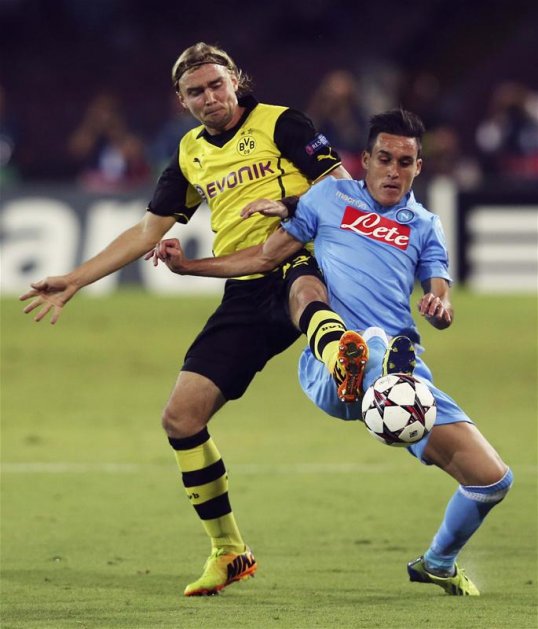 Napoli's Gonzalo Higuain scored the only goal of a frantic first half at Stadio San Paolo to give his side a slender lead over Borussia Dortmund.