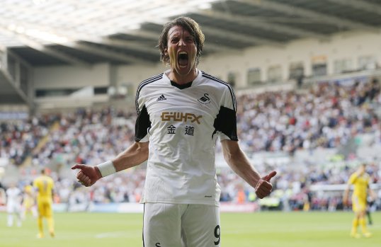 Swansea City outclassed Romanian side Petrolul Ploiesti in the first half of their Europa League play-off first leg and took a comfortable lead into half-time.