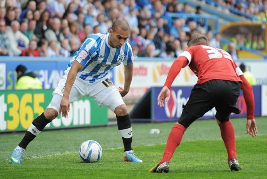 Huddersfield Town have completed the signing of James Vaughan from Norwich City for an undisclosed fee.