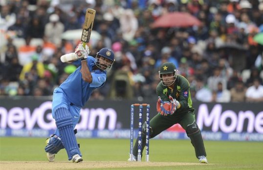 India have beaten Pakistan by eight wickets in a rain-interrupted clash in the Champions Trophy at Edgbaston.
