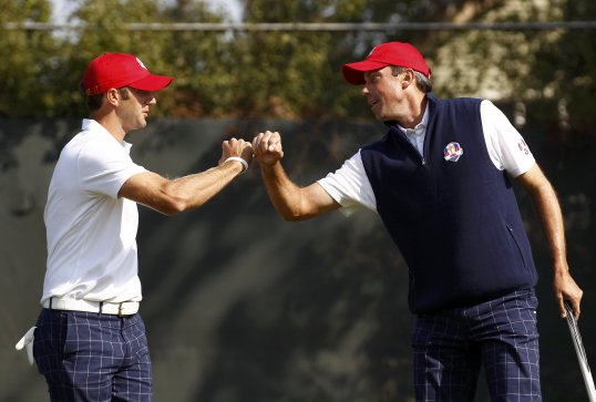 America’s Dustin Johnson and Matt Kuchar make it three points in a row in a crushing Ryder Cup session for Europe.