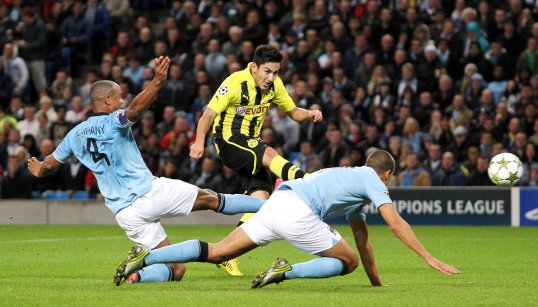 Manchester City and Borussia Dortmund were locked level at half-time, with Joe Hart in sensational form for the home side.