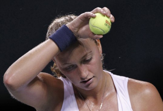 The world No 5 Petra Kvitová was knocked out of the China Open after being beaten by Spain's Carla Suárez Navarro.