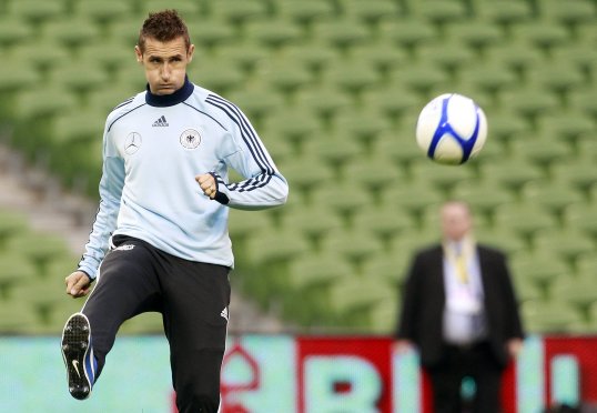 Germany manager Joachim Löw has hailed the international form of striker Miroslav Klose ahead of their World Cup qualifier against Sweden.