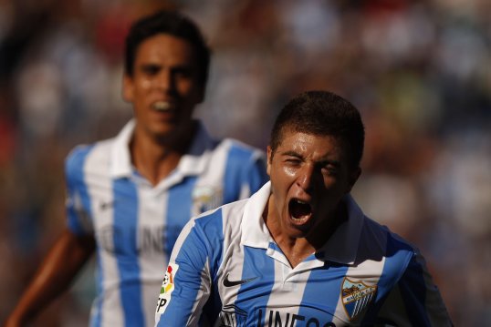 Malaga went top of La Liga after a professional display saw them beat Levante 3-1 at La Rosaleda Stadium.