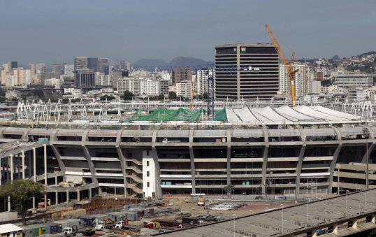 World Cup construction workers building Brazil’s Maracana stadium have downed tools and threatened to go on strike.