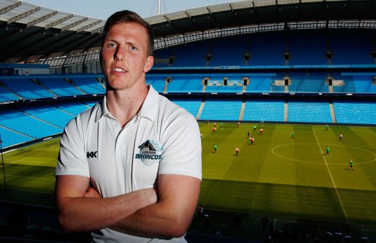 Super League's Magic Weekend will remain at Manchester City's Etihad Stadium for the next two years.