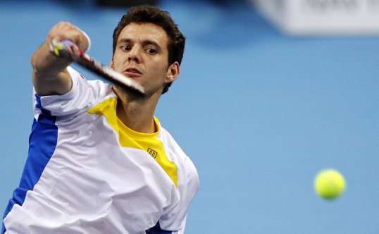 The world no 101 Paul-Henri Mathieu caused an upset at the Swiss Indoors by beating Grigor Dimitrov in a straight sets victory.