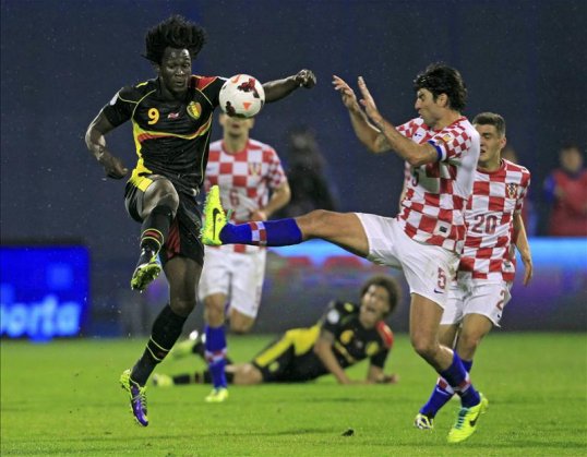 Two goals from Romelu Lukaku helped Belgium secure their place at the 2014 World Cup finals in Brazil after defeating Croatia.