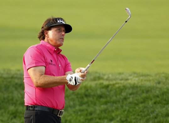 Phil Mickelson has shot a 64 on the third round of the BMW Championship in Indiana to go top alongside Vijay Singh.