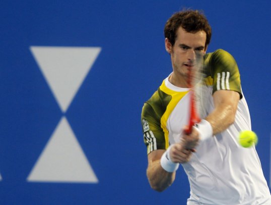 US Open champion Andy Murray lost in straight sets to Janko Tipsarevic in the Mubadala Tennis Championship in Abu Dhabi.