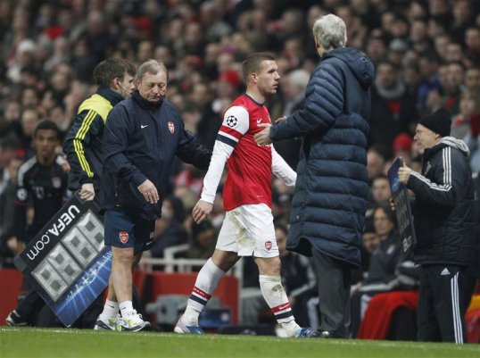 Arsenal striker Lukas Podolski said it will be difficult to score three times in Munich when the teams meet in the second-leg of their Champions League tie in two week’ time.