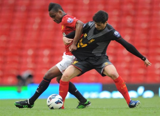 Manchester United hopeful Charni Ekangamene could make his first team debut in Wednesday's League Cup tie away to Stoke City amid great excitement in his native Belgium.