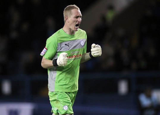 A man has been jailed for 16-weeks after running on to the pitch and punching Sheffield Wednesday goal keeper Chris Kirkland during a Championship match.