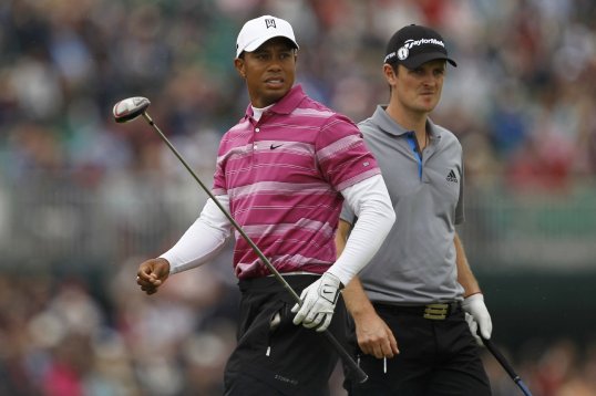 Golf pro's Tiger Woods and Justin Rose shoot a 66 to share the lead after round one of the final Fed Ex Cup event at East Lake.
