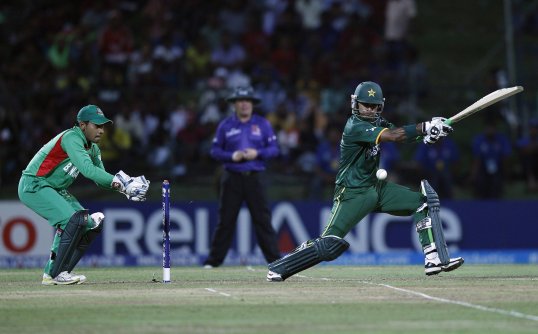 Pakistan have qualified for the World Twenty20 Super Eights round by knocking out Bangladesh in a remarkable run chase