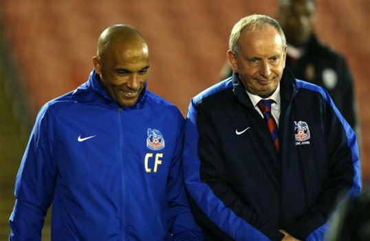 Crystal Palace are demanding a further £350,000 in compensation from Bolton Wanderers for assistant Lennie Lawrence and coach Curtis Fleming.