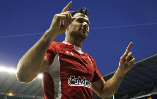 Wales scrum-half Mike Phillips will undergo surgery on a hand injury, ruling him out for two weeks.