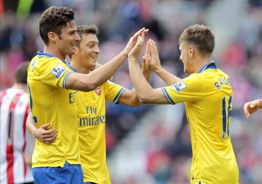 Arsenal midfielder Aaron Ramsey is outperforming club record signing Mesut Ozil in the passing stakes.