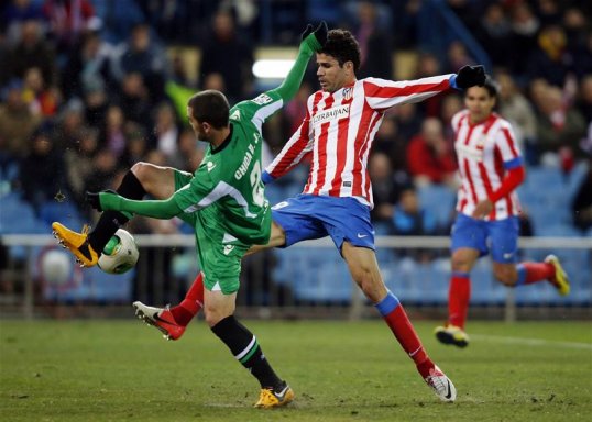 Atlético Madrid managed without their top scorer Radamel Falcao to overcome Real Betis in the quarter-final of the Copa del Rey.
