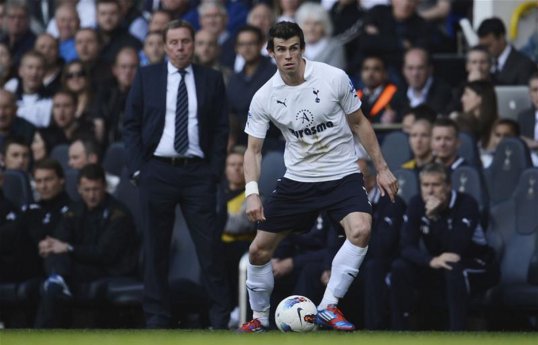 Gareth Bale's former Tottenham Hotspur boss Harry Redknapp reckons the Welshman will stay at the club - at least for another year.