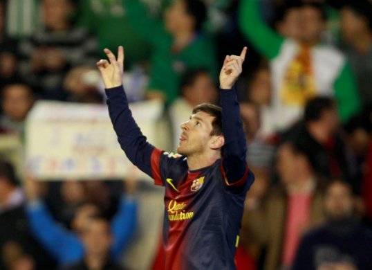 Barcelona forward Lionel Messi struck twice to become the highest goal scorer ever in a calendar year and give his club a 2-1 lead over Real Betis.
