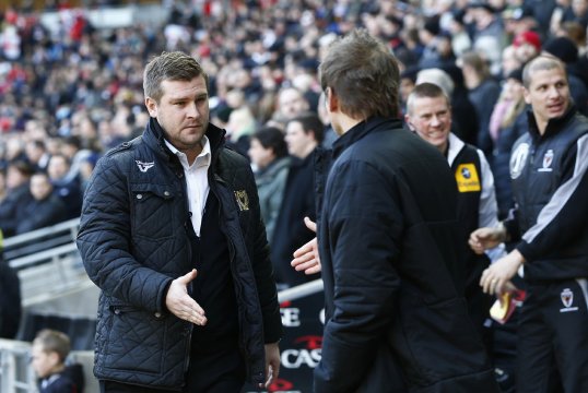 MK Dons manager Karl Robinson has said he was relieved that their FA Cup game against bitter rivals AFC WImbledon passed without any major incidents.