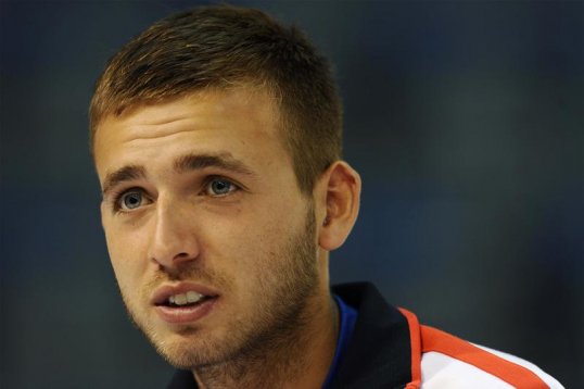 Russia claimed a 1-0 lead over Great Britain in their opening Davis Cup tie after Dimitry Tursunov saw off Dan Evans at Coventry's Ricoh Arena.