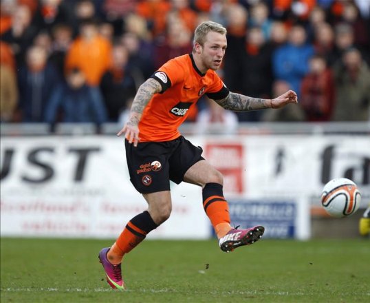 Dundee United striker Johnny Russell has been ruled out for the rest of the season with a broken leg.