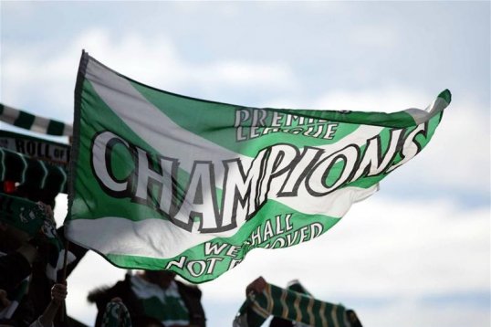 Scottish Premier League clubs have agreed to merge the governing body that would oversee all four divisions.