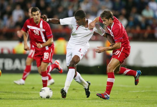 England secured safe passage into Euro 2013, but the match was marred by horrific scenes after the final whistle had blown.