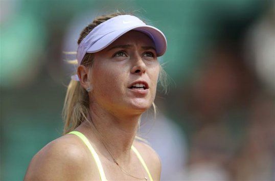 World number two Mario Sharapova has battled her way into the fourth round of the French Open by beating Zheng Jie.