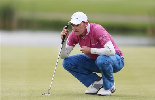 Tim Sluiter has taken the lead after the second day of the Kenya Open after a course-record six under par 65 put him a shot clear of the pack.