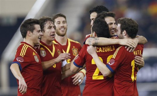 Carles Puyol celebrated his 100th cap for Spain with a 3-1 win over Uruguay in an international friendly in Doha, Qatar.
