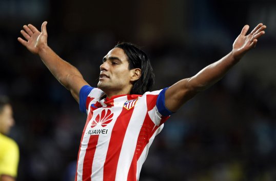 Atlético Madrid almost blew a four-goal lead but still held on to defeat neighbours Rayo Vallecano 4-3 in an entertaining match.