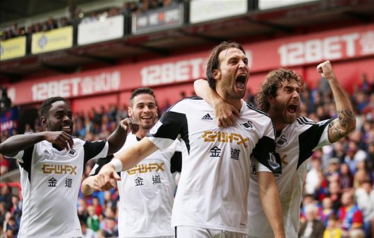 Swansea City striker Michu has expressed his delight at being called up to the Spanish national team for their World Cup double-header this month.