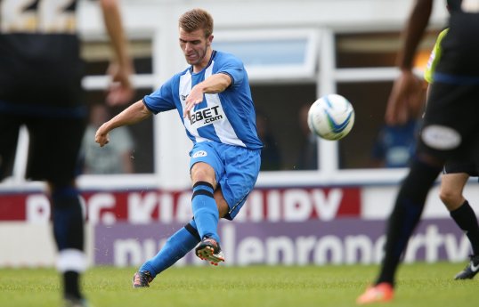 A teenager has been arrested for sending Wigan Athletic forward Callum McManaman a death threat on Twitter.