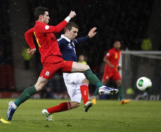 Grant Hanley's injury time header has sent Scotland in at half-time with a precious 1-0 lead against Chris Coleman's Wales.